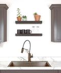 24 Inch Floating Wall Shelf Holds Up To 20 Lbs Tool-Free Drywall Install Flat Black Finish with plants and mugs in a kitchen setting