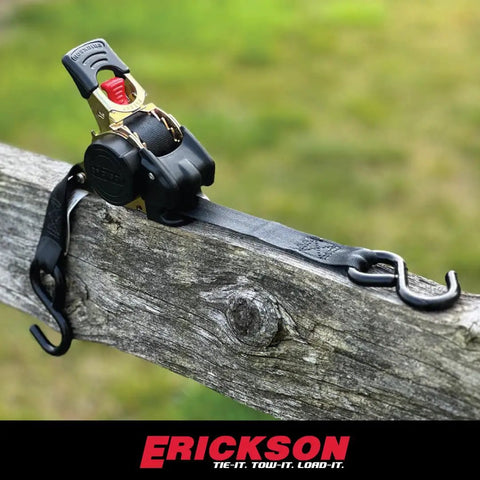 No Nonsense Retractable Ratcheting Tie Down Straps 2 Pack Black 1 In X 6 Ft With Vinyl Coated Hooks on a wooden fence.
