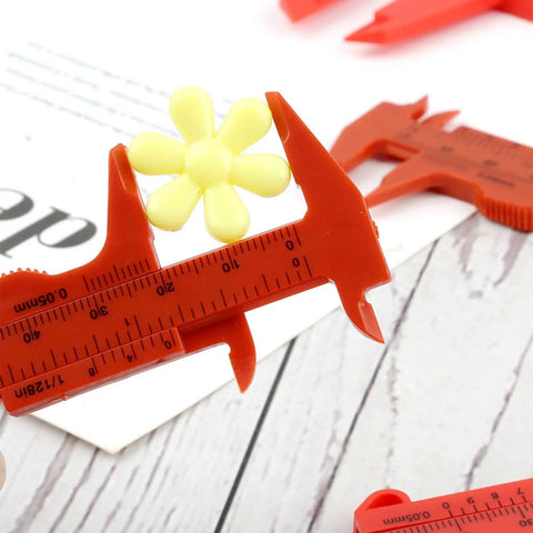 Depth Vernier Caliper Micrometer Gauge Measuring Tool measuring a yellow flower, showcasing its precision in size.