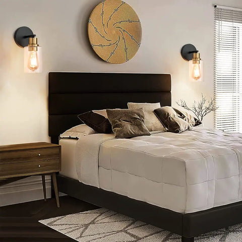 2 Pack Black And Gold Wall Sconces With Clear Glass Shades Sleek Modern Farmhouse Vanity Lights beside bed in bedroom