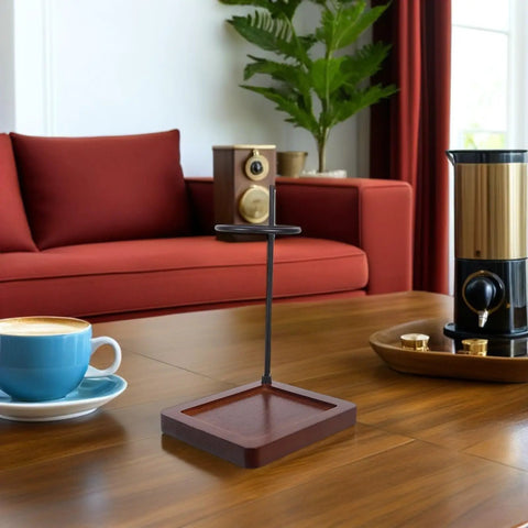 Top Shelf Wood Coffee Dripper Stand Built Tough With Stainless Base on a coffee table, perfect for quick pour over brewing at home.