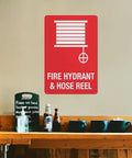 Outdoor Emergency Fire Hydrant And Hose Reel Safety Sign 8x12 Inch Wall Plaque in a kitchen area above shelf items
