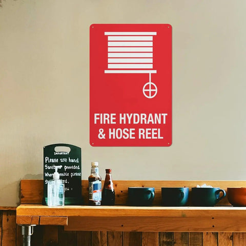 Outdoor Emergency Fire Hydrant And Hose Reel Safety Sign 8x12 Inch Wall Plaque in a kitchen area above shelf items