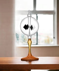 Solar Powered Glass Radiometer With Spinning Vanes Crookes Windmill Desk Decor Gift For Home Or Office on wood table