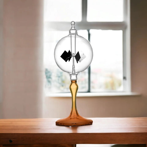 Solar Powered Glass Radiometer With Spinning Vanes Crookes Windmill Desk Decor Gift For Home Or Office on wood table