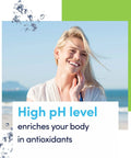 Smiling woman at the beach promoting high pH level benefits for alkalinity and antioxidants