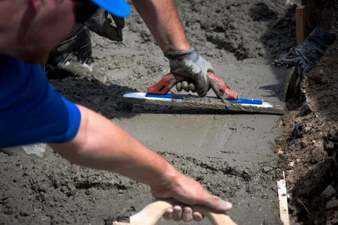 White Lightning Hand Float For Concrete, 16 Inch Blade By 3 Inch, in use on wet concrete surface. Durable polymer blade visible.