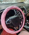 Sweet Baby Pink Steering Wheel Cover Soft Microfiber Leather Universal 15 Inch Thick Quilted Non Slip Pad in car interior.
