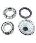 Front view of trailer bearing kit: two steel bearings, rubber axle seal, and clear hub-cap housing.
