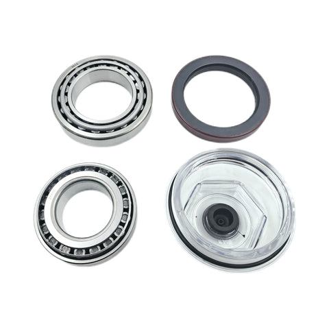 Front view of trailer bearing kit: two steel bearings, rubber axle seal, and clear hub-cap housing.