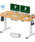 Whole Piece Standing Desk With Clamp Power Strip, 55 Inch By 28 Inch Electric Height Adjustable Desk With Cable Management, shown in workspace setup