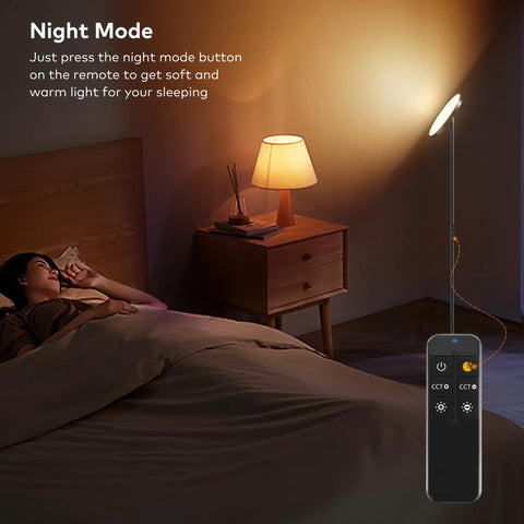 Game-Changing LED Floor Lamp With Remote Control in Night Mode beside a sleeping person in a bedroom setting.