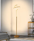 Modern Brass Spiral Floor Lamp With Remote Control, 63 Inch Tall LED 28W, 3 Color Temperatures, Stepless Dimming in a living room corner