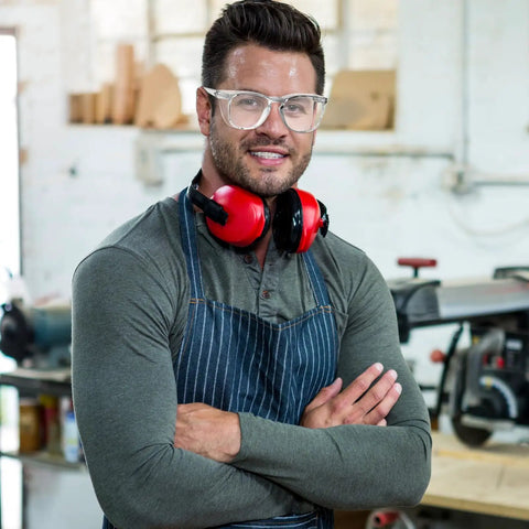 Male worker wearing Heavy Duty 72 Pack Safety Glasses With Side Shields And Rock Solid Ansi Z87 Plus Certification for protection.