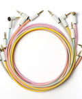 MickXer 5 Way Passive Mixer With Candycord Color Cables Six Pack And Noise Filtering Kit featuring 3.5mm mini jack cords in pastel colors.