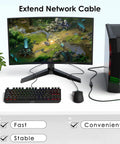 Gaming computer setup with monitor, keyboard, and tower connecting with RJ45 Ethernet Cable Extender Coupler for Cat5 to Cat8 cables.