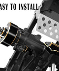 Close-up of Brass Link Mounts Panhard Suspension Kit for 1/10 RC Cars TRX4 TRX6 installed on front axle with black finish.