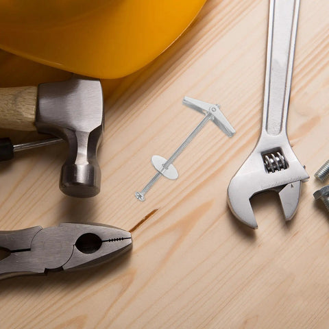 Heavy Duty Drywall Toggle Bolts And Wing Nuts Kit with tools on wooden surface