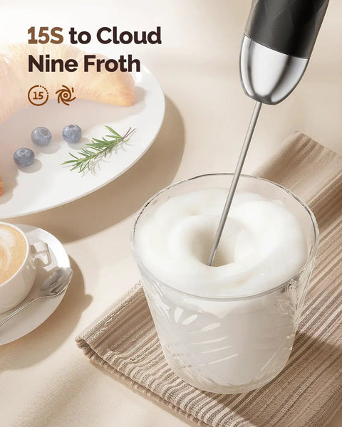 Rechargeable Milk Frother With Stepless Speed Control LunaFro V2 Handheld Electric Foam Maker frothing milk in a glass