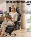 Woman sitting on Big And Tall Leather Office Chair With Footrest High Back Ergonomic Gaming Chair Pocket Spring Lumbar Support And Outward Fixed Soft Armrests For Executive Comfort And All Day Back Support, reading a book.