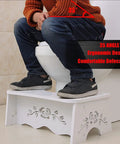 Person using Ergonomic Squatting Toilet Stool For Adults, Sturdy Detachable Wood Plastic Composite Step Stool for better posture.