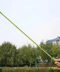 Beefy Portable Telescopic Fishing Rod With 360 Degree Rotating Tip Carbon Fiber Imitation Green Bamboo Design held outdoors