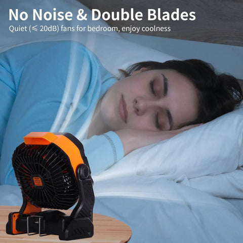 Powerful Battery Powered Camping Fan With 20000mAh Battery Rechargeable Outdoor Tent Fan With Light And Hook Go To USB Desk Fan For Camping And Travel Double Blade 270 Degree Pivot Orange on table near sleeping person