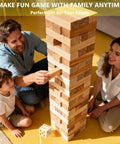 Family playing with Giant Wooden Tumbling Tower 5.3 Feet Tall With 60 Premium Pieces at home living room.