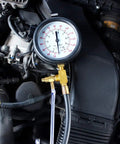 Pro Fuel Injection Pressure Tester Kit with 0 to 140 PSI gauge installed in engine bay, showcasing usage with fuel lines.