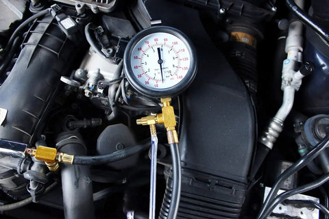 Pro Fuel Injection Pressure Tester Kit with 0 to 140 PSI gauge installed in engine bay, showcasing usage with fuel lines.