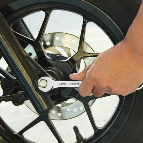 14mm Flexible Gear Wrench With 12 Point Flex Head For Tight Spaces, Industrial Grade Ratcheting Combination Wrench in use on a wheel
