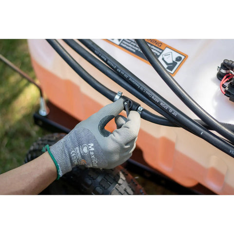 Hand adjusting hose connection on Tow-Behind Garden Sprayer With 15 Gallon Tank, 30 Inch Boom, 1.6 GPM At 100 PSI, 23 Inch Spray Wand