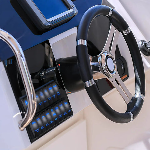 Beefy Blue 5 Pin LED Rocker Switch SPST On Off 20A 12V 10A 24V with jumper wires on a boat dashboard
