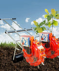 Double Row Seed Spreader For Garden And Farm, Portable Manual Seeder With Hand Push Roller next to young plant in soil