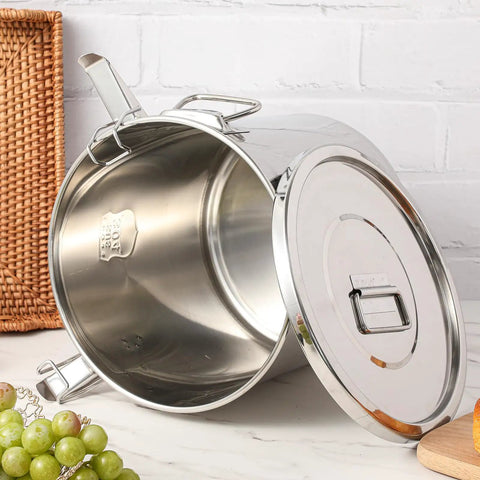 Stack It High With Heavy Duty 304 Stainless Steel Airtight Canisters 3 Pack Featuring Slam Lock Clamps For Bulk Flour Rice Grains Coffee Beans And Pet Food Storage Keeps Your Pantry Fresh With Zero Sweat Total Kitchen Flex 12L 21L And 33L, open stainless steel canister with lid.