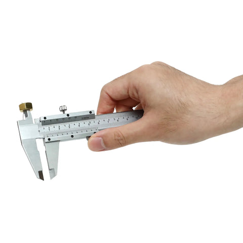 Hand holding Vernier Caliper 0-6 Inch / 0-150 Millimeters Manual Caliper Carbon Steel Pro Grade with knurled thumb roller and locking screw