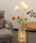 Pastoral LED Floor Lamp With Handwoven Rattan Flower Shade For Cozy Vibe near armchair and table in living room corner