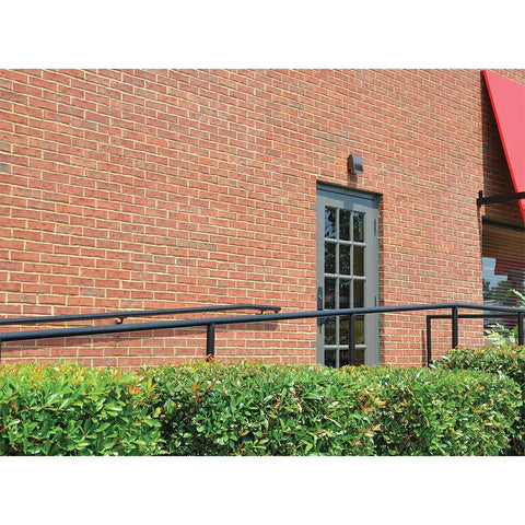 Crosstour 26W Carbon Outdoor Integrated LED Wall Pack With 4000K Neutral White, Bronze Finish on brick building exterior