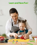 melican Kids Kitchen Knife Set front view on a yellow cutting board; mother and daughter cooking with kid-safe tools