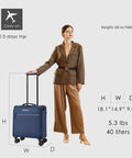 Woman with Underseat Carry On Luggage 15 Inch Softside With Spinner Wheels USB Port Navy Carry On Friendly Travel Case