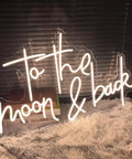 Cozy indoor To The Moon And Back LED Neon Light Sign with Adjustable Brightness Flexible Silicone Neon Strip on a fluffy rug