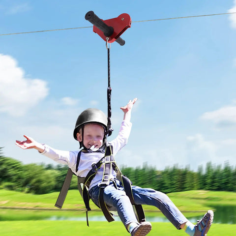 Child using Backyard Zipline Kit With 120 Feet Of Cable Helmet Spring Brake Adjustable Harness Non Slip Gloves And All Around Safety Gear