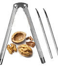 Beefy All Metal Nutcracker Tool for Cracking Nuts Lobster Claws Crabs and Tough Shells with two picks next to cracked walnuts