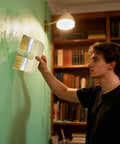 Man using Dope U Shape Deck Stain Brush With Double Bristles For Smooth Color Coating on green interior wall