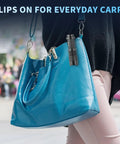 5 Pack SK68 Tactical Flashlights clipped to blue handbag, highlighting everyday carry feature.