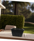 Hydroponic Plant Basket Net Pots 2 Pack For Veggie Growing, black plastic mesh pot shown on table outdoors
