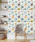 Slick Pastel Woodland Peel And Stick Wallpaper With Cute Animal Head Prints on a feature wall in a cozy room setting.
