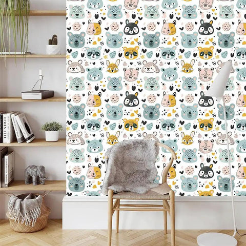 Slick Pastel Woodland Peel And Stick Wallpaper With Cute Animal Head Prints on a feature wall in a cozy room setting.