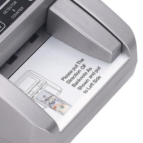 Super Fast Bill Counting Machine For US Dollars With Counterfeit Detection And Smart Value Tracker feeding a bill into the slot.