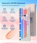 Pink Creamy Ultimate Mechanical Keyboard With Integrated Display Screen Tri Mode Hot Swappable Switches Wireless 98 Layout Gaming Board For True Dope Rigs, top view showing key layout and display.